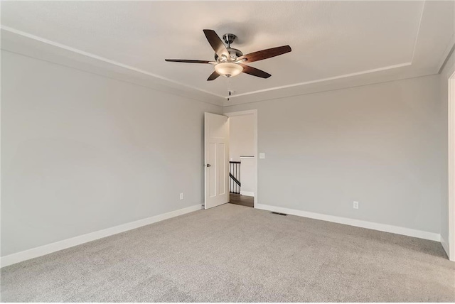 unfurnished room featuring carpet flooring and ceiling fan