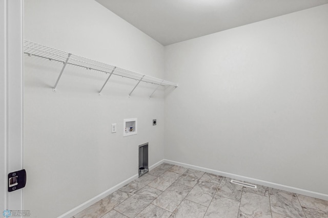 washroom featuring laundry area, electric dryer hookup, marble finish floor, washer hookup, and baseboards