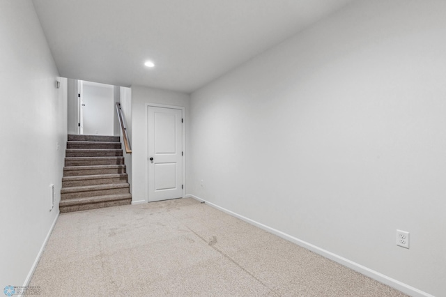 interior space with carpet floors, baseboards, recessed lighting, and stairs