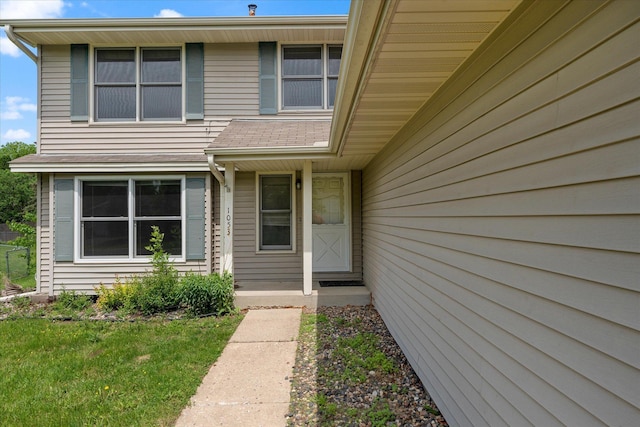 property entrance with a yard