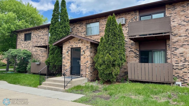 view of front of property with a balcony