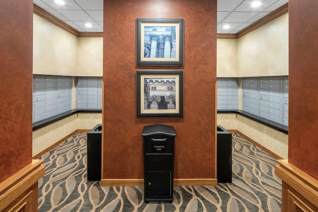 interior space featuring mail boxes and crown molding