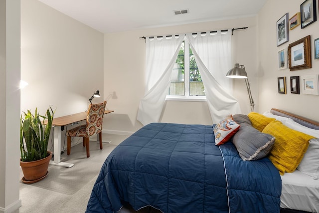 bedroom with light carpet