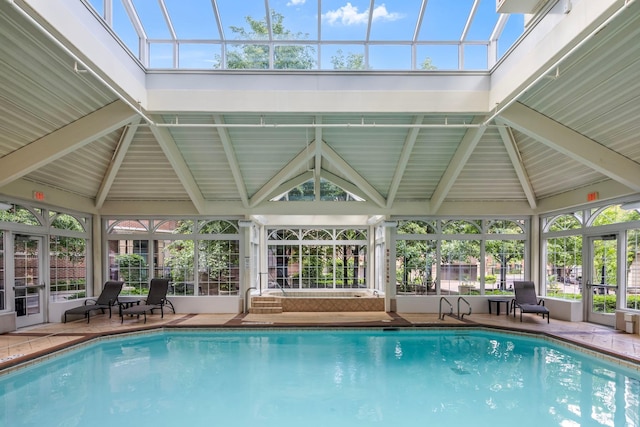 view of pool featuring a gazebo, a patio area, and glass enclosure