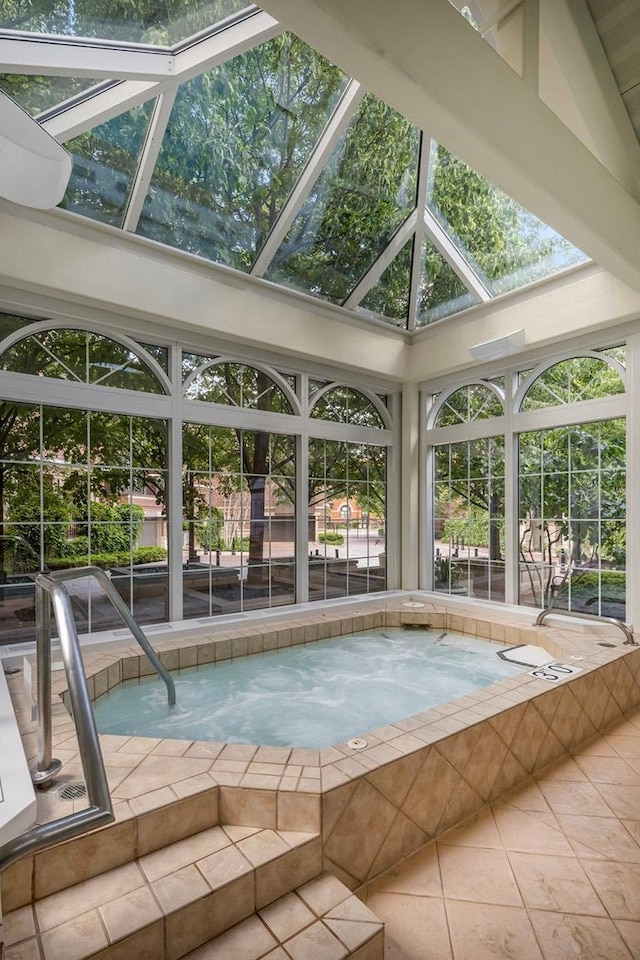 view of pool featuring an in ground hot tub