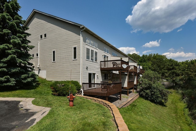 3799 Larabee Ave NE, Saint Michael, MN 55376 - rear view of house with a deck and a lawn