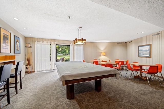 game room with carpet flooring, a textured ceiling, and pool table