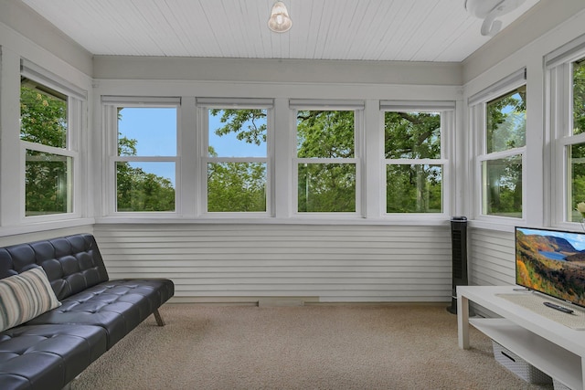 sunroom / solarium featuring a healthy amount of sunlight