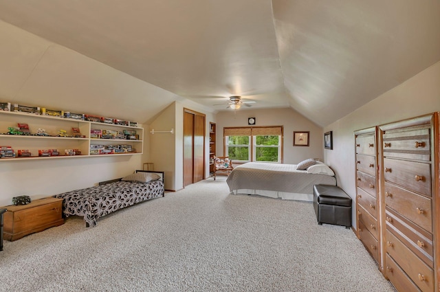 carpeted bedroom with vaulted ceiling and ceiling fan