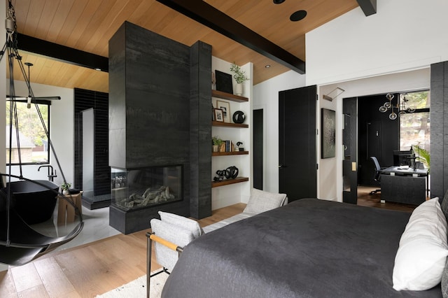 bedroom featuring vaulted ceiling with beams, light hardwood / wood-style floors, wooden ceiling, and a multi sided fireplace