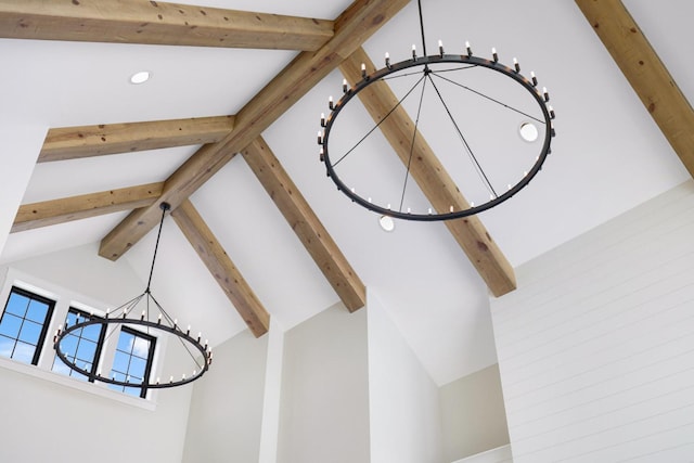 detailed view of a chandelier, beam ceiling, and recessed lighting