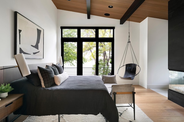 bedroom with wood finished floors, wood ceiling, and baseboards