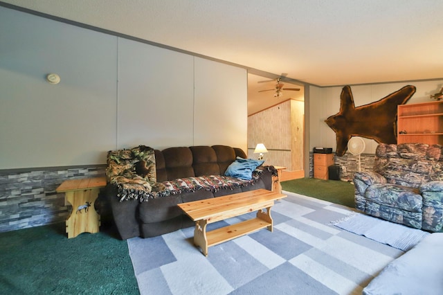 living room with ceiling fan, carpet, and crown molding