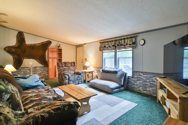 carpeted living room featuring a textured ceiling