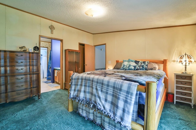 carpeted bedroom featuring a textured ceiling, ensuite bathroom, and ornamental molding