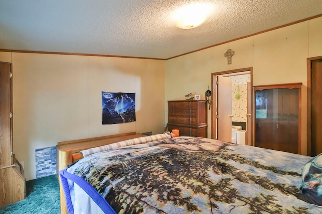 bedroom featuring crown molding and a textured ceiling