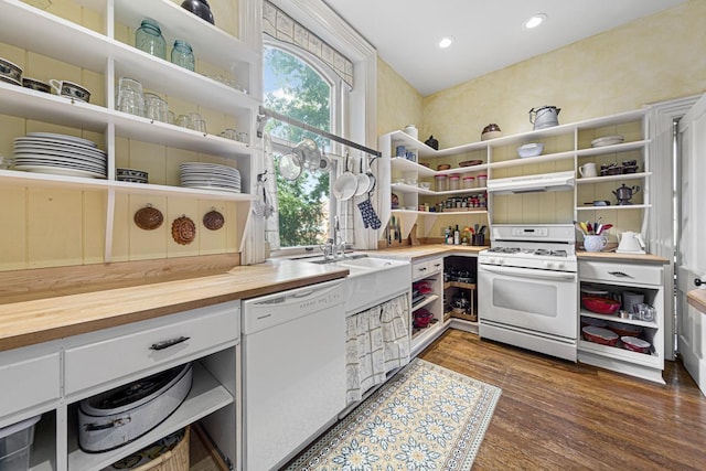 kitchen with open shelves, white appliances, wood counters, and under cabinet range hood