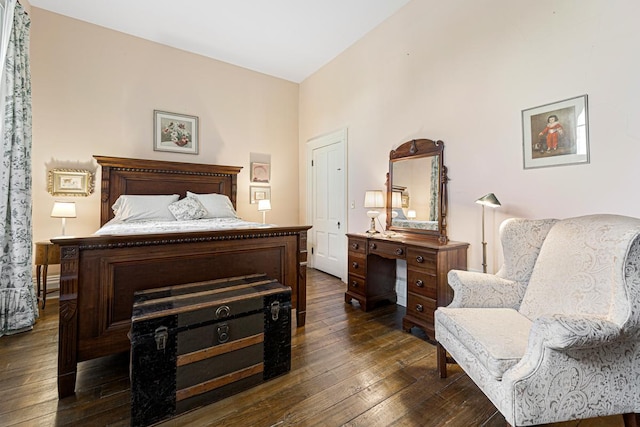 bedroom with dark wood-style floors