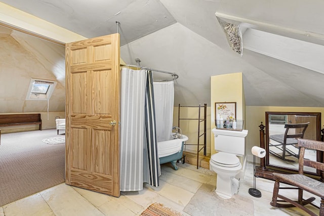 bathroom featuring toilet, a shower with curtain, and vaulted ceiling with skylight