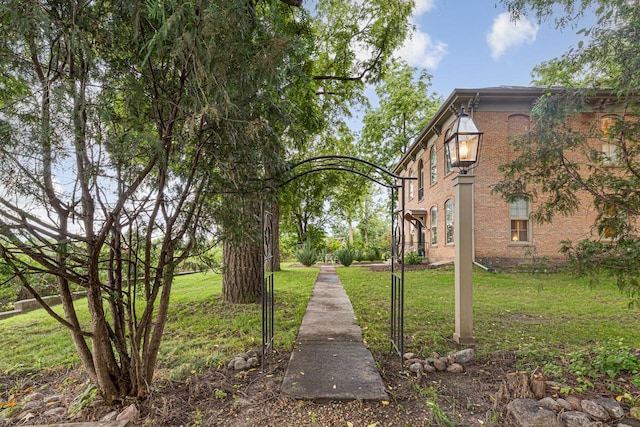 view of property's community with a yard