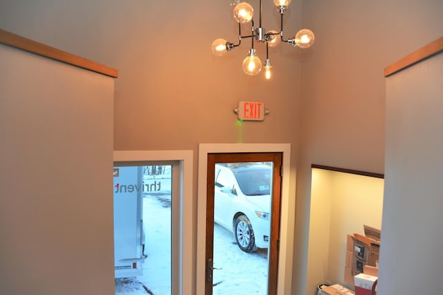 entryway featuring a chandelier