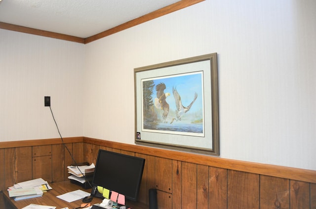 unfurnished office with a textured ceiling and crown molding