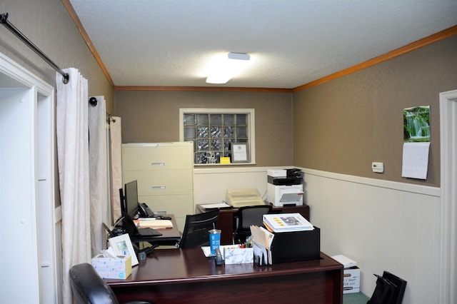 office area with ornamental molding and a textured ceiling