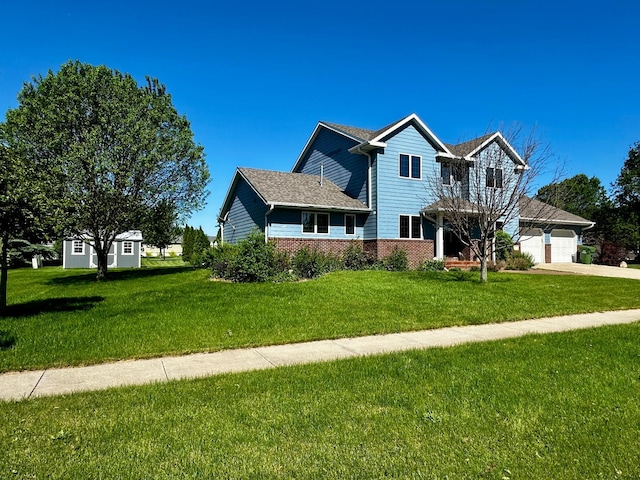 traditional-style house with an attached garage, a front lawn, concrete driveway, and brick siding