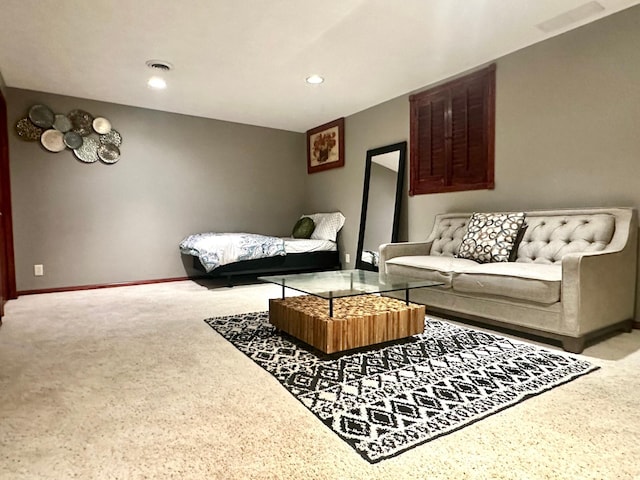 living area featuring recessed lighting, visible vents, and baseboards