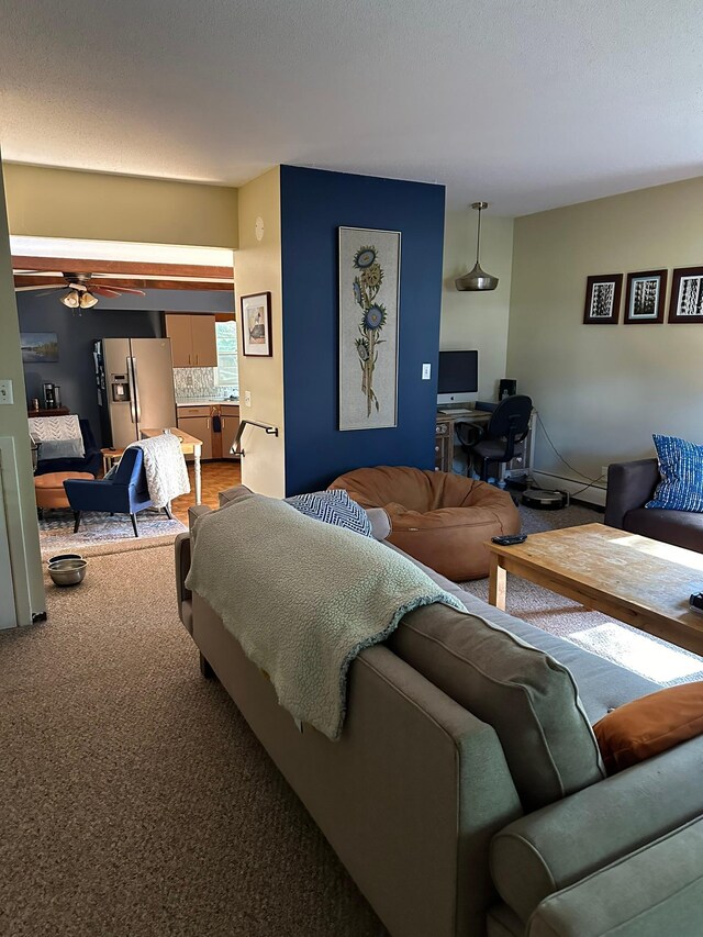 carpeted living room featuring ceiling fan