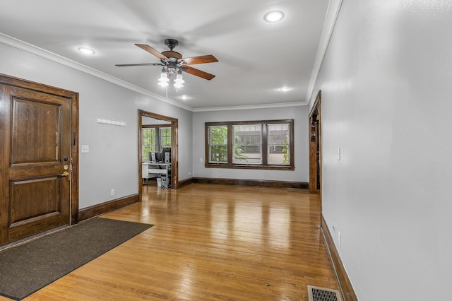 entrance foyer with crown molding, ceiling fan, and light hardwood / wood-style flooring