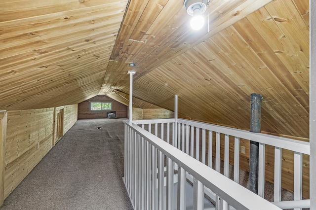 bonus room featuring wood ceiling, carpet flooring, vaulted ceiling, and wood walls