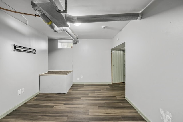 basement with dark wood-type flooring