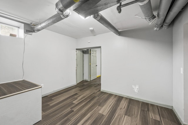 basement with dark wood-type flooring