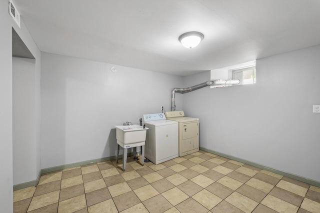 clothes washing area featuring separate washer and dryer