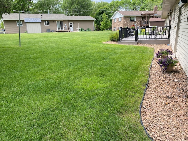 view of yard with a deck