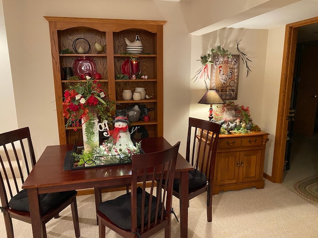 dining room with light carpet