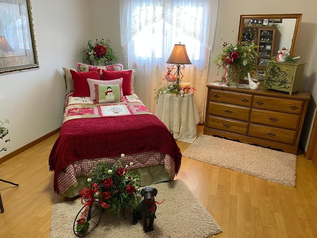 bedroom with light hardwood / wood-style floors