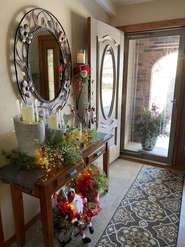 foyer featuring light tile patterned flooring