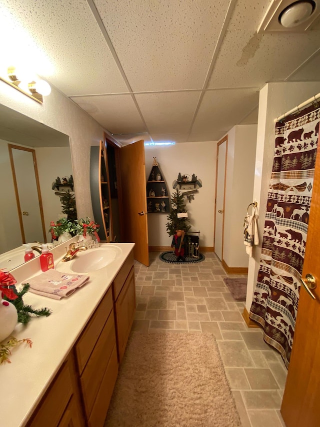 bathroom featuring vanity and a paneled ceiling