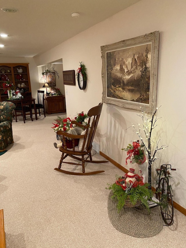 sitting room featuring carpet flooring