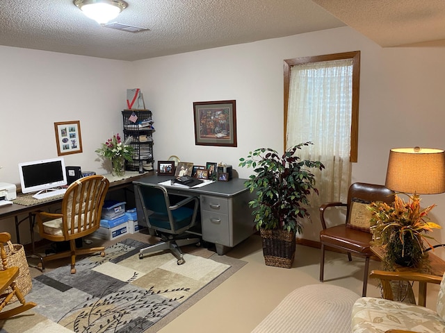 office with a textured ceiling