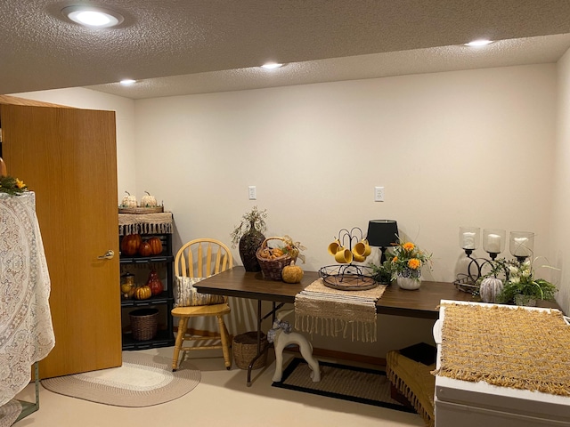 dining room with a textured ceiling