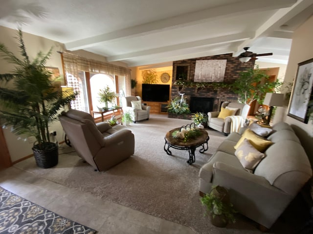 living area featuring vaulted ceiling with beams and a fireplace