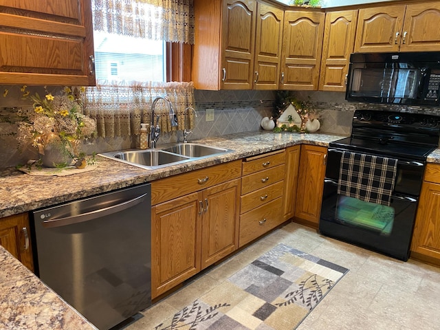 kitchen with decorative backsplash, brown cabinets, a sink, and black appliances