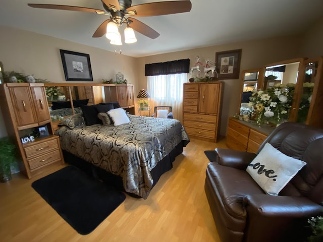 bedroom featuring light wood-type flooring and ceiling fan