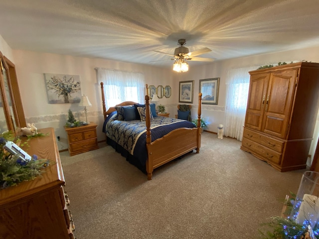 bedroom with light carpet and ceiling fan