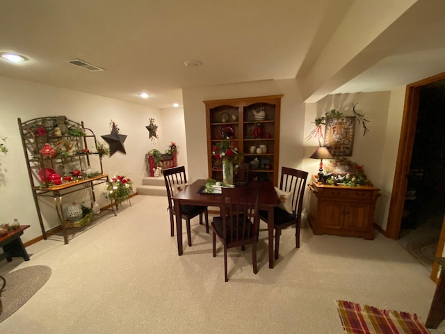 carpeted dining space featuring visible vents and recessed lighting