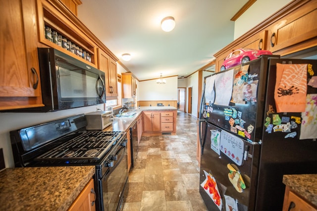 kitchen featuring black appliances, light tile patterned flooring, ornamental molding, and kitchen peninsula