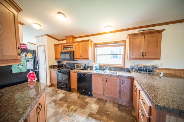 kitchen featuring sink, tile patterned floors, crown molding, and black appliances